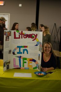 Sophomore, Kasie McCann at the Celebration of Student Writing event. She wrote about taking certain parts of someones life and interweaving them like the game of life, we are all connected. She took different parts of peoples life that they thought were important to them and interwove them.