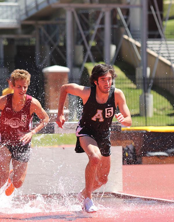 Freshmen+Kyle+McFloy+and+Mason+Rivera+compete+in+the+Steeple+Chase+in+Friday+afternoon%E2%80%99s+track+meet.+Paul+Heckert+%7C+The+Appalachian