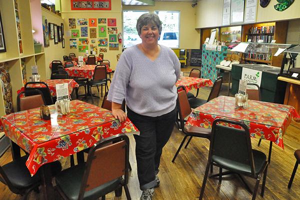 F.A.R.M. Café Executive Director Renee Boughman stands in the newly-completed restaurant. The café, which opens Tuesday, is a non-profit organization that runs almost entirely with volunteers and seeks to provide wholesome meals for everyone. Photo by Maggie Cozens | The Appalachian