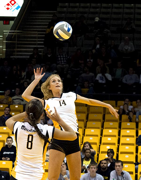 Sophomore middle blocker Lauren Gray prepares to hit the ball Tuesday night at a home game versus North Carolina A&T in Holmes Convocation Center. The Mountaineers dominated the Aggies with a 3-0 win. Olivia Wilkes | The Appalachian