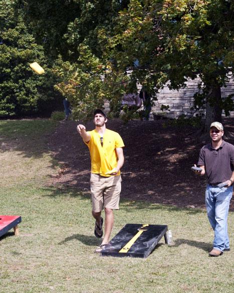 Students and faculty participate in the cornhole tournament on Sanford Mall Friday. The tournament was held by the sustainable development club in order to raise money for a corn mill in Africa. Courtney Roskos | The Appalachian