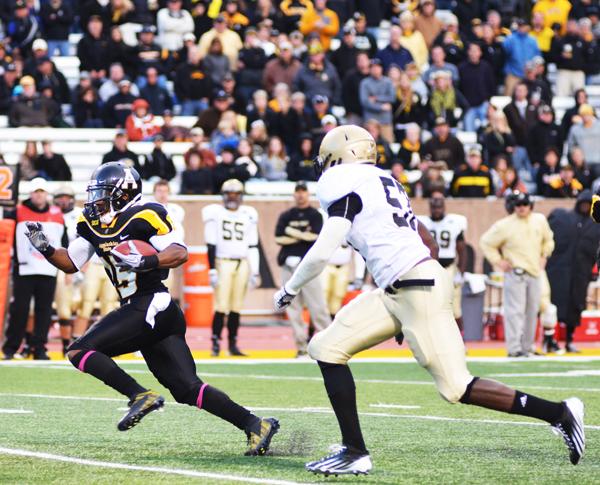 Junior wide receiver Tony Washington races down the field with the ball during Saturday's game against Wofford. The Mountaineers lost to the Terriers 38-28. Aneisy Cardo | The Appalachian