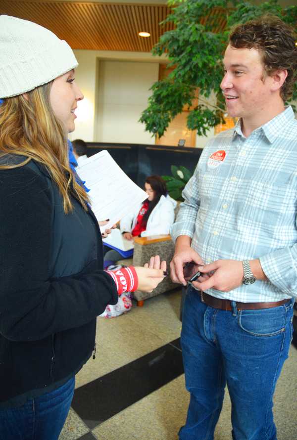 Candidate for Watauga County Commissioner Tommy Adams speaks with sophomore spanish major Nicole Salmon at last Mondays Rock the Vote event. Several candidates have spent considerable time on campus during this election season to encourage students to participate in early voting. Maggie Cozens | The Appalachin