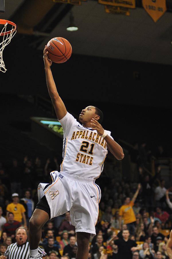 Freshman guard Frank Eaves reaches for a basket during last Fridays game against Montreat. The Mountaineers took the victory with a score of 86-50. Justin Perry | The Appalachian