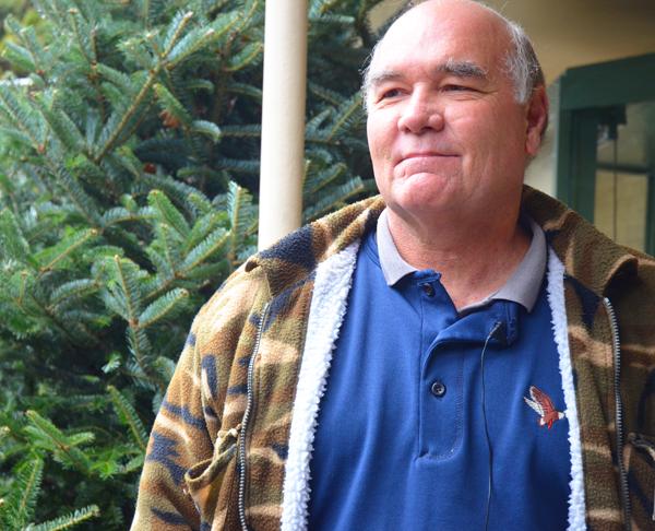 Howard Hughes works as a christmas tree seller at Wahoos off of highway 321. The christmas trees come from RRR Tree Farm, located in Boone. Maggie Cozens | The Appalachian