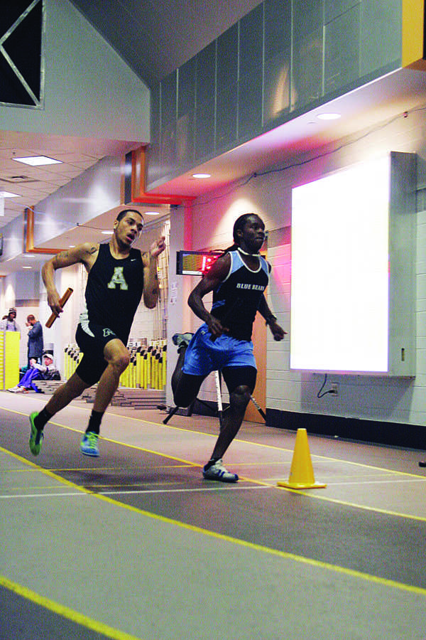 Freshman Industrial Design major Chase Helton competes in the mens 4 by 4 on Saturday afternoon. The Mountaineers hosted this meet in the Convocation center. Courtney Roskos | The Appalachian