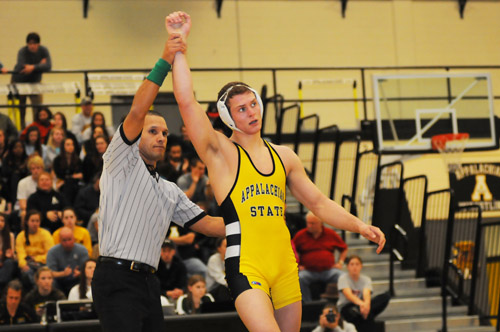 Freshman Zach Strickland is announced as the winner at a home match. Starting as a redshirt, Strickland quickly became a star on the team and has led a perfect individual season.