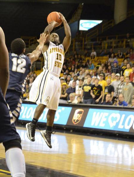 Freshman point guard Chris Burgess shoots the winning shot during overtime against Georgia Southern in last Thursday’s game.