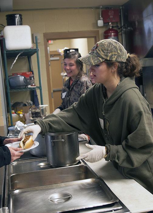 Sophomore apparel design and merchandising major Kelsey Stryker serves lunch at the Hospitality House. Students volunteered at various local locations as part of the 14th Annual Martin Luther King Challenge.