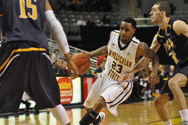 Sophomore guard Mike Neal moves the ball down the court during Monday nights game against UNCG. App State came back in the second half to defeat the Spartans 83-70.