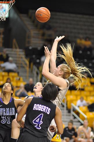 Senior forward Kelsey Sharkey lays the ball up during Mondays game against Furman. The Mountaineers beat the Paladins 68-58.
