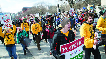 Groups of students form a yellow sea amongst the estimated 40,000 participants as they march down the streets of Washington, D.C. in the ‘Forward on Climate’ rally Sunday afternoon. Around 150 students traveled from Boone wearing shirts that read ‘Fossil Free App State’ to protest the Keystone XL Pipeline. Olivia Wilkes | The Appalachian