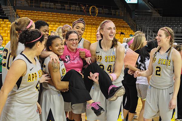 Head coach Darcie Vincent is paraded around by the women’s basketball team at the conclusion of Saturday’s game against Wofford. The win marked Vincent’s 100th career win as head coach at Appalachian State. Justin Perry | The Appalachian