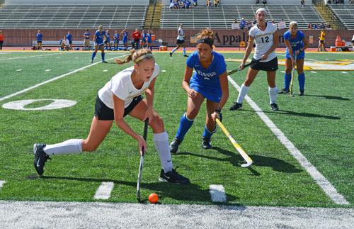 Freshman forward Hanna French attempts to keep the puck in play from a Delaware defender in a match last fall. The team recently gained six recruits for the 2013 spring season. Aneisy Cardo | The Appalachian