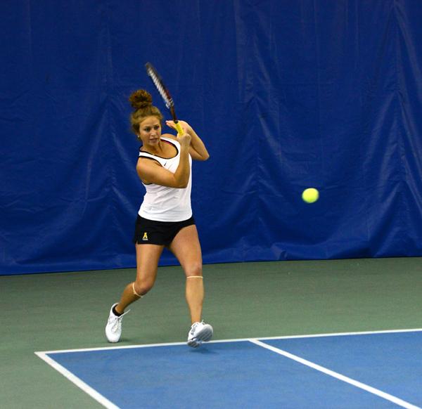 Senior Jennifer Ansari hits the ball Satuday afternoon during her doubles match versus East Tennessee State University at Yonahlossee Raquet Club. The Mountaineers lost their first match to ETSU 6-1. Olivia Wilkes | The Appalachian