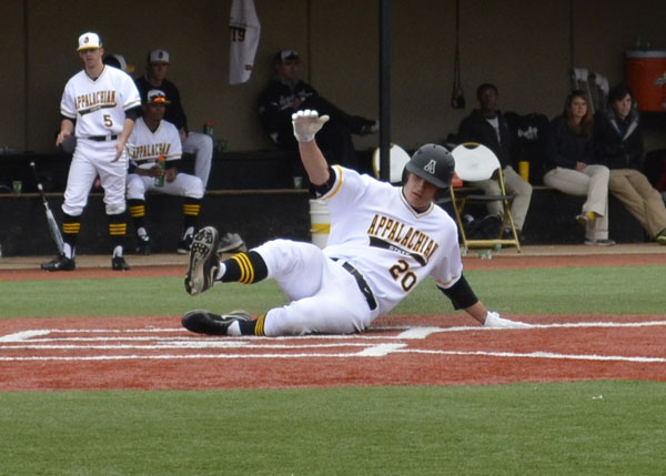 Junior catcher Josh Zumbrook slides into home base during the game Saturday against Butler. The Mountaineers won 6-2 in the first game out of three. Aneisy Cardo | The Appalachian