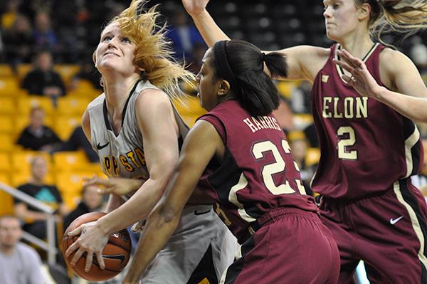 Senior forward Kelsey Sharkey fights to put the ball in the basket in Saturday afternoons 80-62 win against Elon.