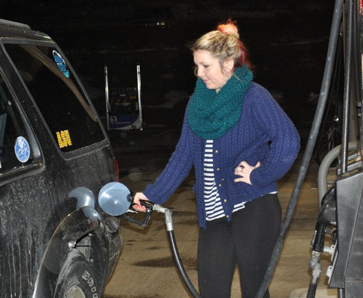 Sophomore art education major Ian Evans fills her tank at Carolina Petro in Boone. It costs approximately $60 to fill her Ford Explorer. Maggie Boutwell | The Appalachian