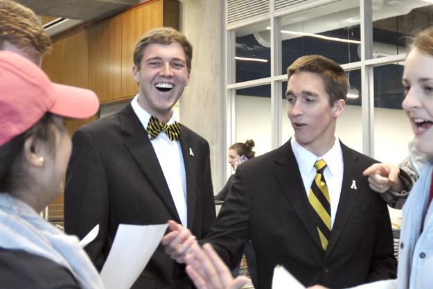 Presidential elect Dylan Russell (left) and vice presidential running mate Michael Page (right) celebrate while reading the offical results of the SGA elections Tuesday. Justin Perry | The Appalachian