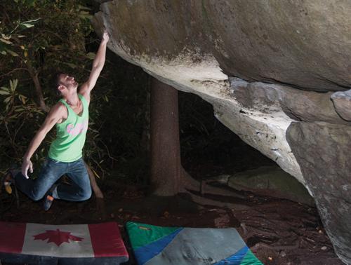 Senior criminal justice major Jeremy Parnell works on a boulder problem at Grandmother Mountain. Parnell will attend the Rocks for Research event this weekend in Charlotte. Joey Johnson | The Appalachian