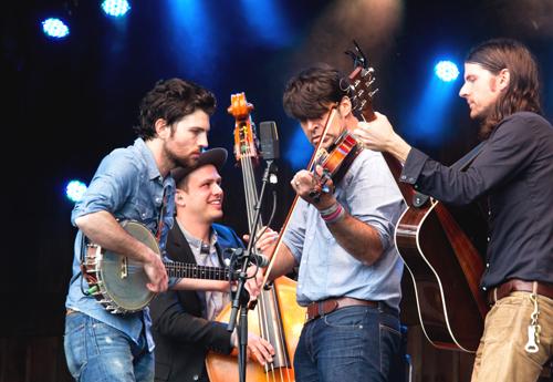 This year’s festival, the first without Watson after 25 years, The Avett Brothers play through heavy rain to close their hour-and-a-half set with ‘Blue Ridge Mountain Blues,’ taught to them by the late Doc Watson, on Sunday at MerleFest 2013. This year's festival hosted 76,000 participants and focused on the celebration of the life and music of Doc Watson. Paul Heckert | The Appalachian