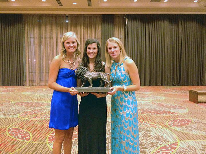 (left to right) Alpha Delta Pi presidents past and present Molly Elliot (2012), Alexis Wilkins (2013) and Laura Stewart (2011) are presented with The Golden Lion award earlier this year. The Golden Lion award recognizes leadership and community participation and is the highest chapter performance award that can be received. Photo courtesy of Alexis Wilkins.