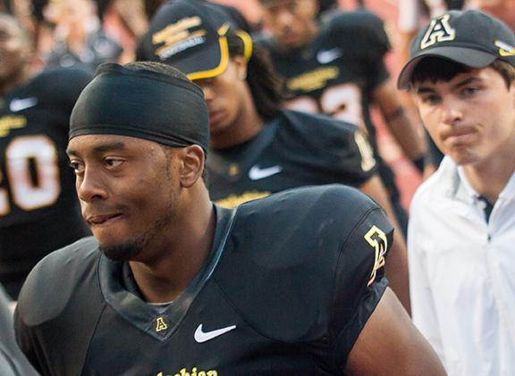 Sophomore quarterback Kameron Bryant walks off the field to the locker room after a disappointing first half against N.C. A&T. Photo by Paul Heckert | The Appalachian