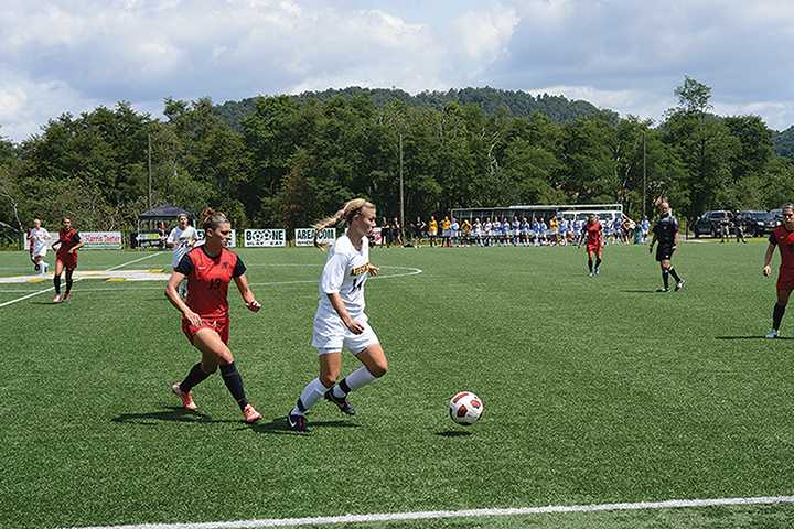 Sophomore forward Sam Childress dribbles the ball during the second home game of the season against Austin Peay. Photo by Courtney Roskos | The Appalachian