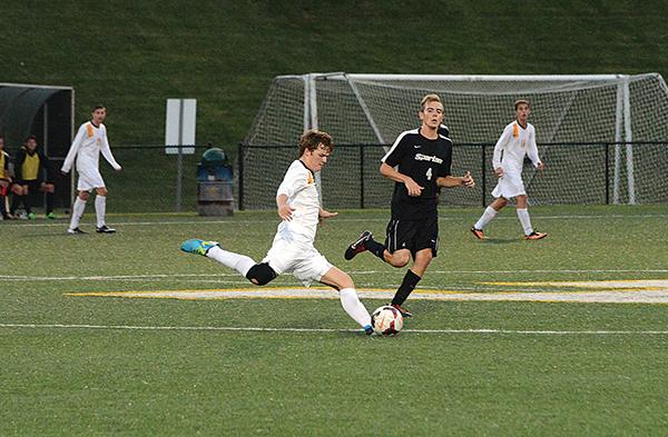 Sophomore midfielder Matthew Melton kicks the ball down the field Saturday night at a home game against USC-Upstate. The Mountaineers tied with the Spartans 1-1. Photo by Olivia Wilkes | The Appalachian