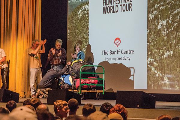 Godfrey Masauli, one of the directors of the film “The Boy Who Flies,” receives a set of paragliding equipment from local business owners at the 17th annual Banff Festival on Saturday. Photo by Lovey Cooper | The Appalachian