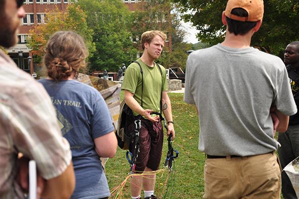 Benjamin Jordan, director of the film “The Boy Who Flies,” demonstrates paragliding and kite making to students on Sanford Mall on Friday. Approximately 40 students showed up to make kites out of newspaper and share their aspirations for the future. Photo by Justin Perry | The Appalachian