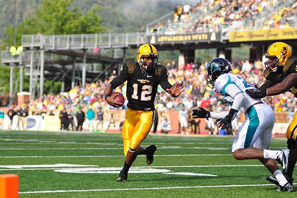 Senior quarterback Jamal Londry-Jackson runs the ball toward the endzone against Coastal Carolina last season. Londry-Jackson is 40-62 for 414 yards this season. He has thrown two touchdowns and averages 138 passing yards per game. Photo by Justin Perry | The Appalachian