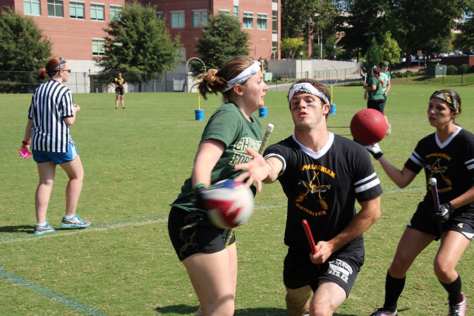 Chaser Sean Ecker tosses the quaffle before taking a hit from a UNC Charlotte chaser. Jacob Huddleston | Courtesy Photo