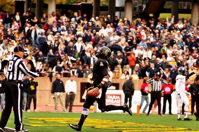Sophomore quarterback Kameron Bryant runs the ball into the end zone from the two yard line in their annual Black Saturday game against Georgia Southern. He finished 27-33 for 381 yards and two touchdowns. The Mountaineers beat the Eagles 38-14. Photo by Justin Perry | The Appalachian