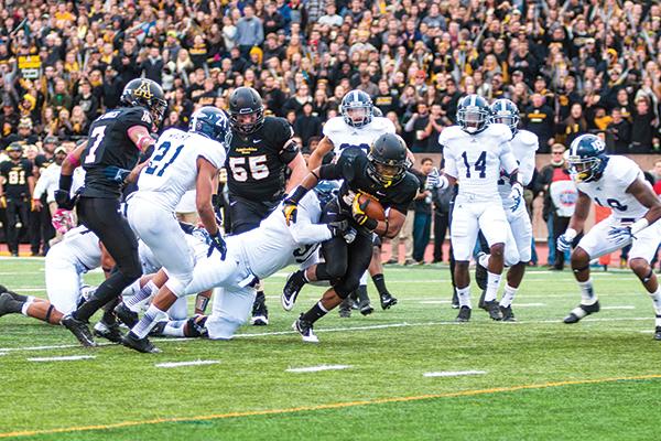 Freshman running back Marcus Cox rushes to the end zone during the Black Saturday game against Georgia Southern. The Mountaineers flew past the Eagles for a 38-14 victory at home. Photo by Aneisy Cardo | The Appalachian