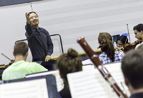 Chung Park, Director of Orchestral Activities, cues the bassoons in a run of Beethoven’s Pastoral Symphony during a rehearsal for the Symphony’s upcoming concert. The concert takes place in the Schaefer Center for the Performing Arts at 8 p.m. Friday and will feature professor Bair Shagdaron on piano. Photo by Paul Heckert | The Appalachian