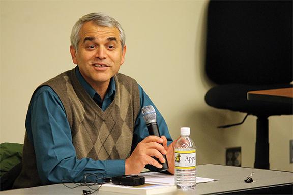 Professor in the Department of Computer Science Rahman Tashakkori spoke Tuesday night at a panel discussion based on the book ‘The Children of Abraham: Judaism, Christianity, Islam’ by F. E. Peters. Appalachian faculty briefly spoke about their experience with three monotheistic religions and took questions from the audience. Photo by Molly Cogburn | The Appalachian