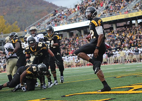 Quarterback Jamal Londry-Jackson looks at the crowd after breaking through the Terrier defensive line to run the ball in for a touchdown against Wofford in 2012. The Mountaineers lost the game, 38-28. Photo by Paul Heckert | The Appalachian