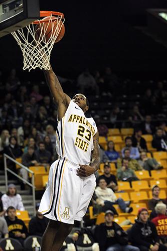 Mike Neal dunks the ball during Tuesday night's game against Lees-McRae. The Mountaineers slammed the Bobcats for a solid 91-63 win at home. Photo by Paul Heckert | The Appalachian