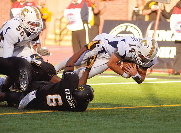 Freshman outside linebacker Kennan Gilchrist attempts to stop Chattanooga quarterback Jacob Heusman from scoring a touchdown. The Mountaineers fell to the Mocs 25-28 at home, making this the Mocs first win in Mountaineer territory since 1983. Photo by Justin Perry | The Appalachian