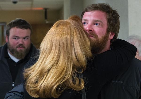 Boone mayoral elect Andy Ball (right) receives an emotional hug from his mother Amy Edelberg after his win was confirmed Tuesday night. Photo by Paul Heckert | The Appalachian