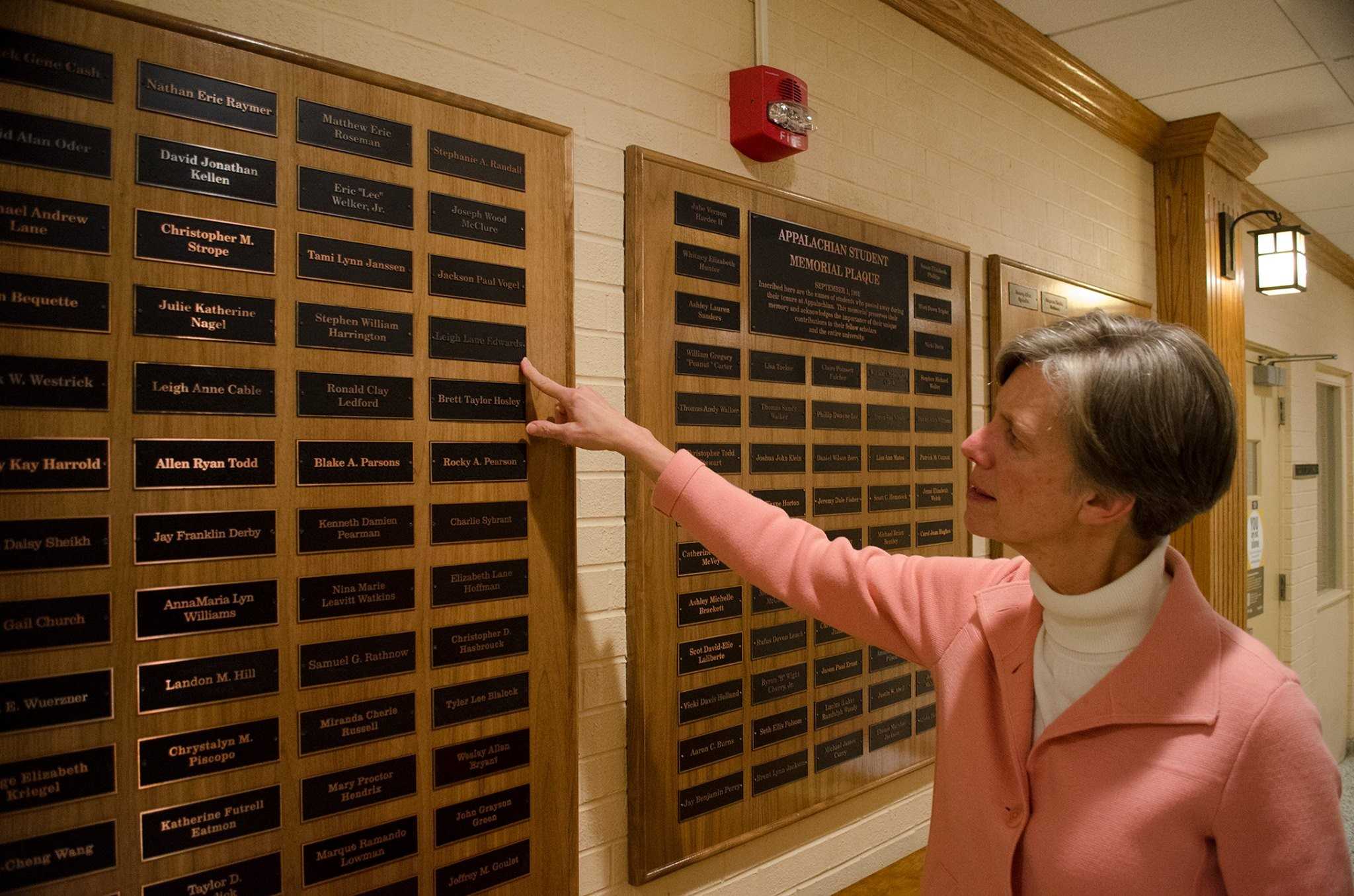 Vice Chancellor Cindy Wallace looks over the more than 150 names on the Appalachian Student Memorial Plaque, which holds the names of students who passed away while they were enrolled since September 2001. Photo by Michael Bragg  |  The Appalachian