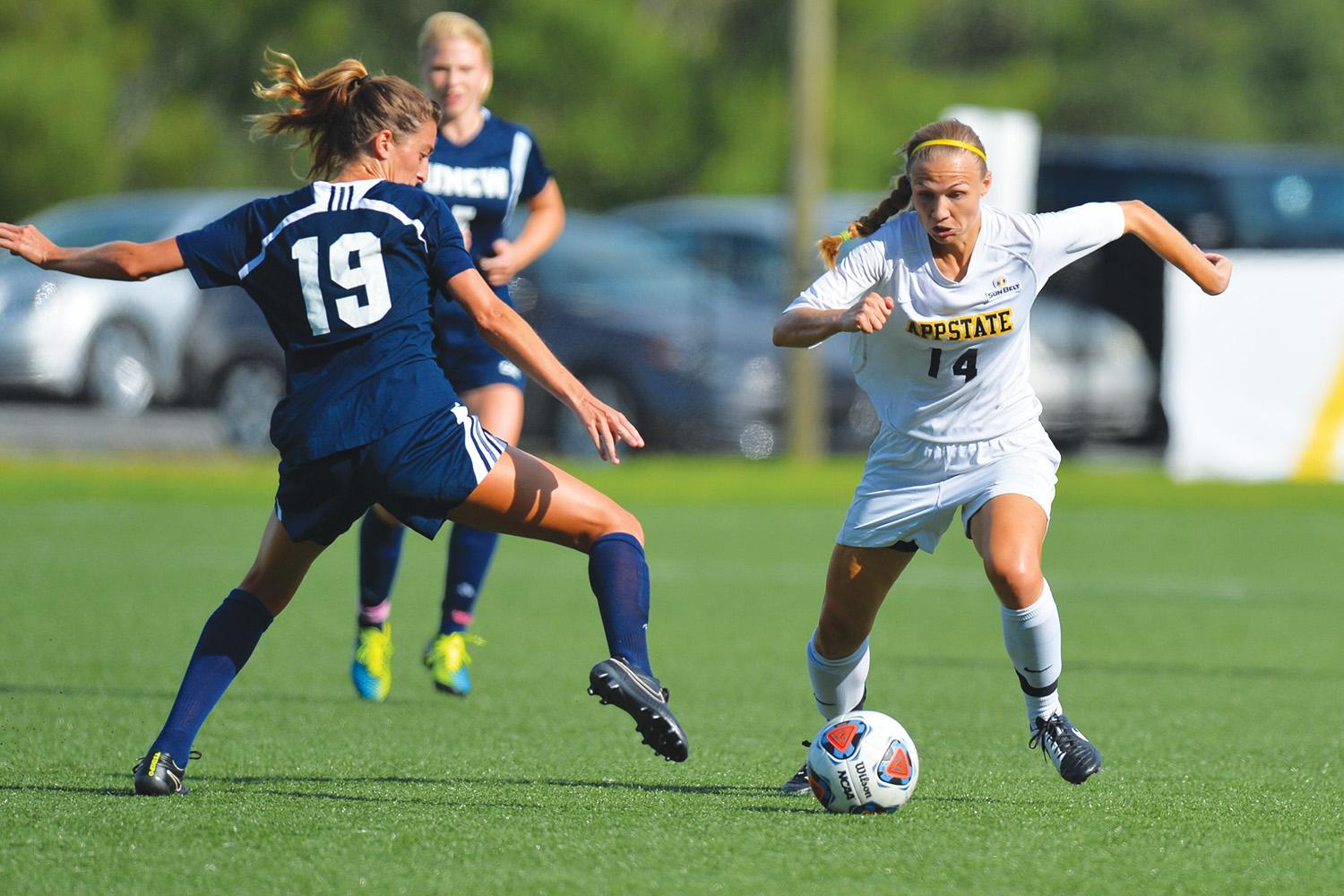 Senior forward Samantha Childress dribbles around the defense during Friday’s home game against UNCW. The Mountaineers scored three unanswered second half goals to defeat UNCW, 3-2. Photo courtesy of Tim Cowie  |  Appalachian State Athletics