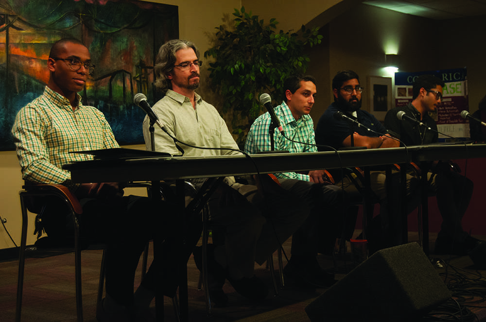 (From left to right) Sophomore communication major Brandon Partridge, government and justice professor Matt Robinson, student conduct interim director James Lorello, junior political science major Smit Patel and senior political science major Reginald Gravely serve as panelists for the Men Speaking Out Against Violence Panel at Crossroads on Wednesday night. Photo by Nicole Debartolo  |  The Appalachian