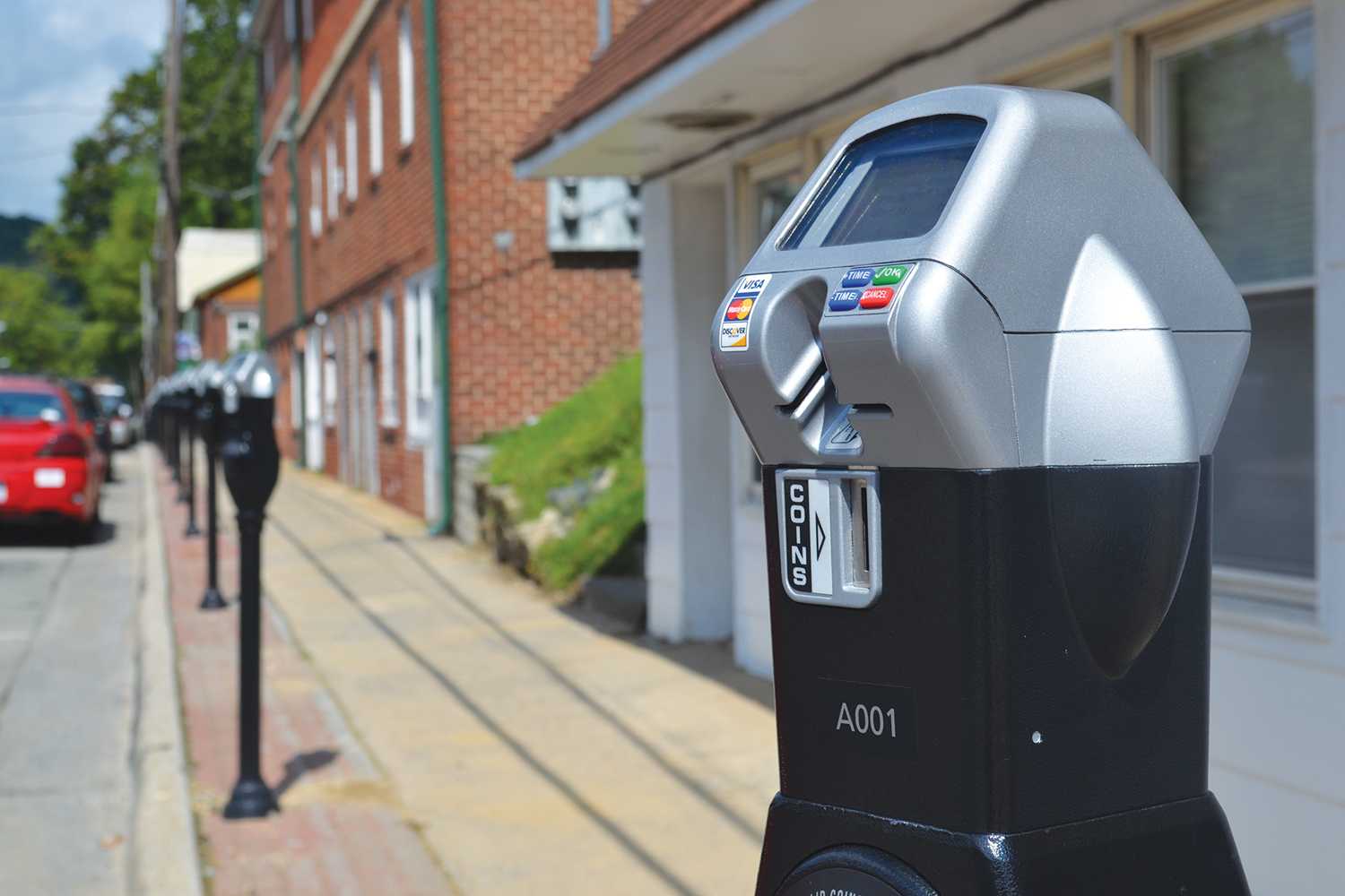 The Town of Boone uses meters and meter attendants to regulate parking downtown.