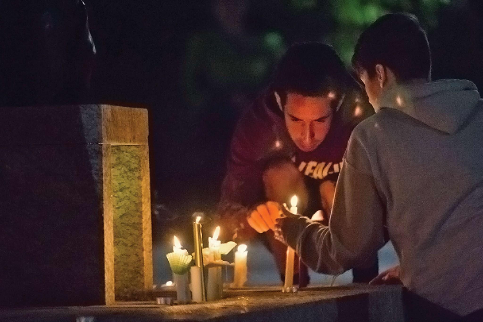 Students lighting candles on Sanford Mall last year at the vigil held in honor of Anna Smith. Smith was found deceased in the woods after 11 days of being missing.