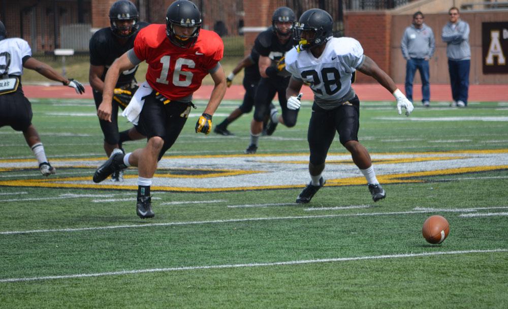 Rain doesnt stop football scrimmage as spring game nears