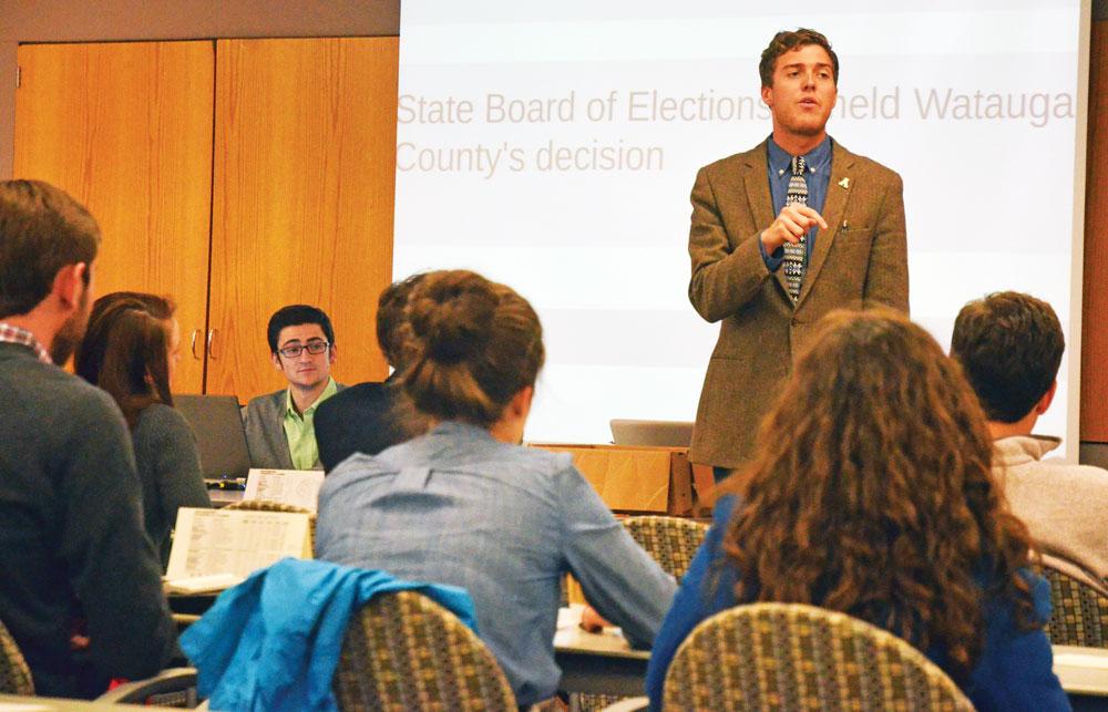 SGA president Dylan Russell discusses a bill that will put students on Boone Town Council committees during Tuesday’s SGA meeting. The bill was approved with 46 out of 47 votes. Photo by Maggie Cozens  |  The Appalachian