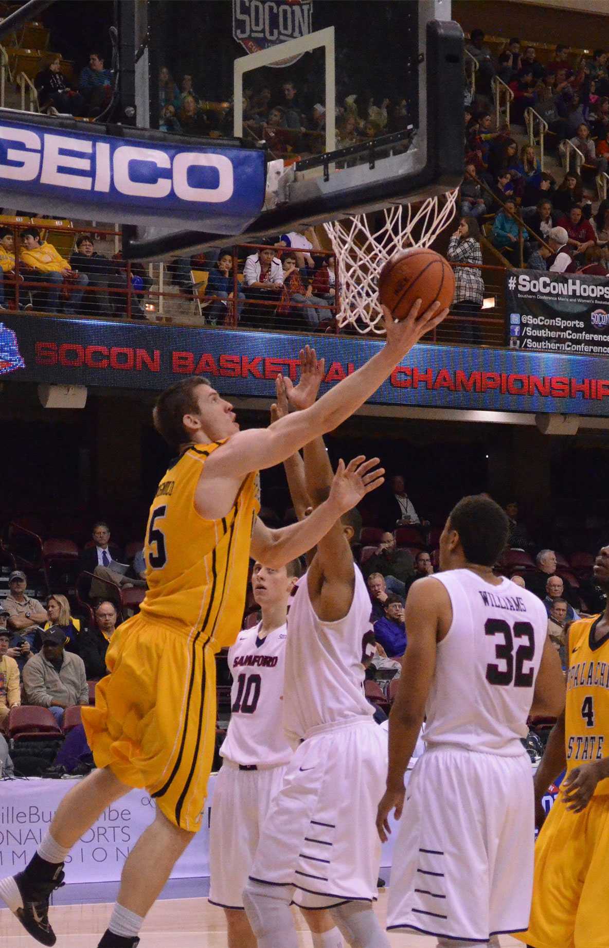 Senior forward Tommy Spagnolo lays up the ball under the basket against  Samford during the first round of the SoCon basketball tournament. Samford defeated Appalachian State 70-56. Photo by Josh Farmer  |  The Appalachian 