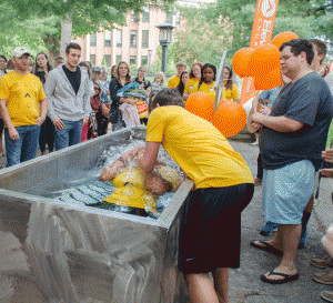 Junior biology major Gloria Agboglo being baptized by site coordinator Jeremy Herba at Elevation on Sunday afternoon. Herba baptized six students on Sunday. Photo by Morgan Cook  |  The Appalachian